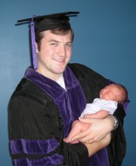 Jay Mastin holding daughter Hannah just days after his graduation from law school!