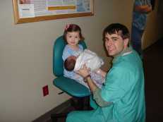 Baby Joseph Thomas Trebus with proud sister and father.